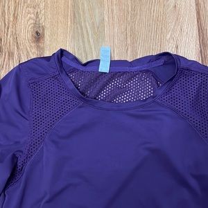 Fabletics purple long sleeve shirt with netting near beach and back opening